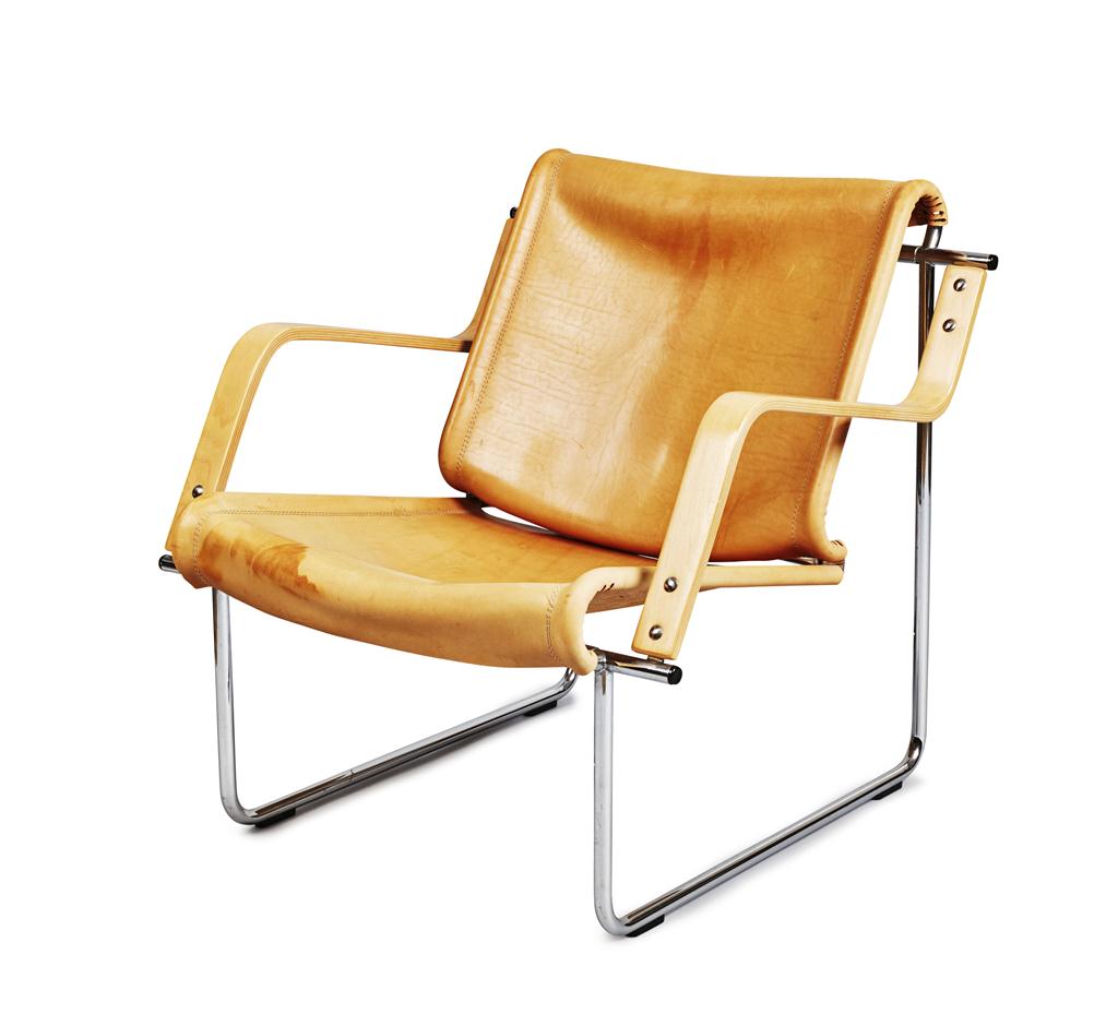 Appraisal: CHROME AND LEATHER-UPHOLSTERED ARMCHAIR S with slung leather seat and