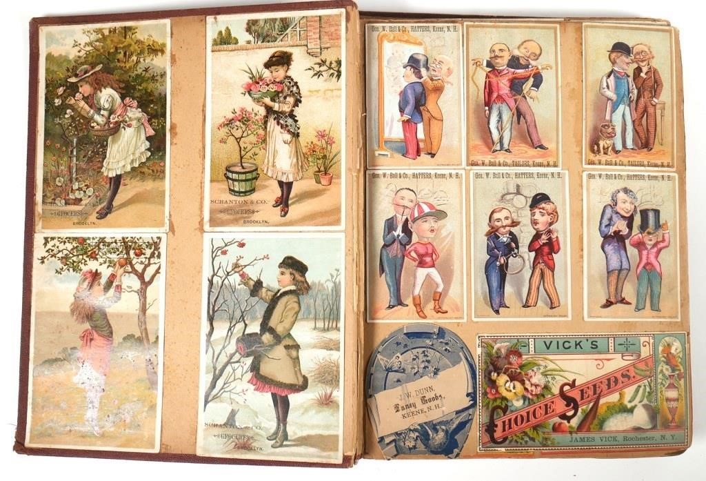 Appraisal: Album collection of antique trade cards affixed to filled pages