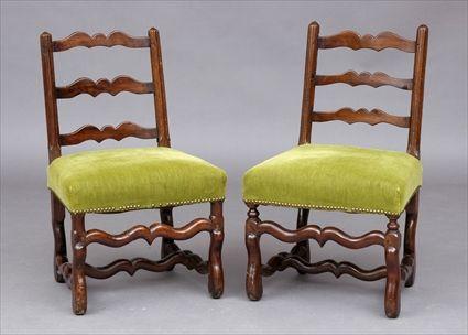 Appraisal: PAIR OF LOUIS XIV PROVINCIAL WALNUT CHAISES Each waved top