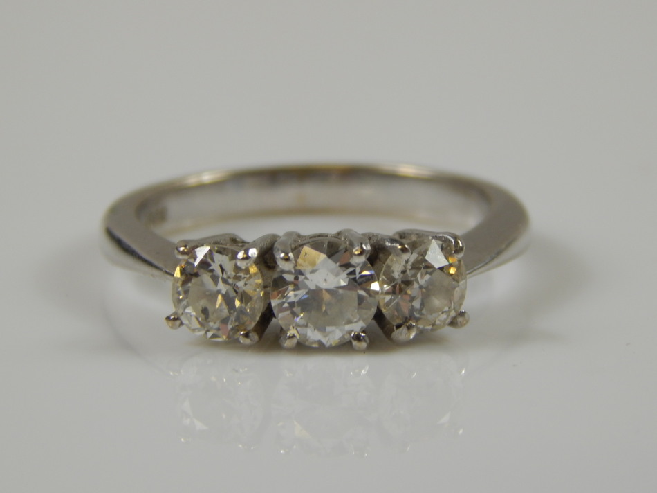 Appraisal: An ct white gold three stone diamond ring the round