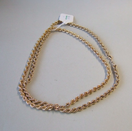 Appraisal: Two ct gold ropetwist link neckchains each with a boltring