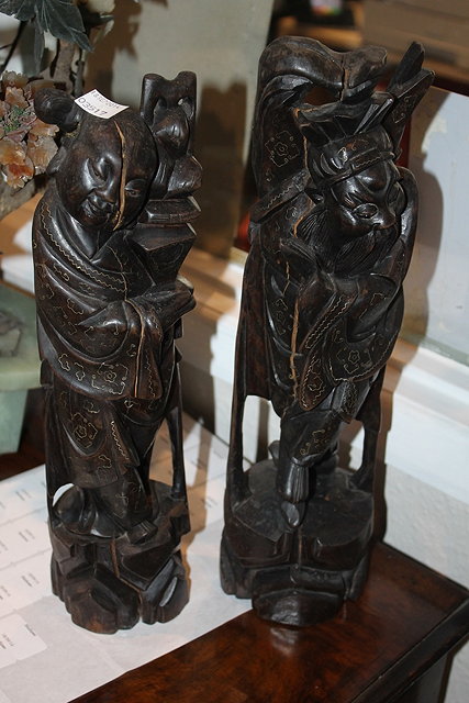 Appraisal: A PAIR OF CHINESE CARVED HARDWOOD AND SILVER INLAID FIGURES