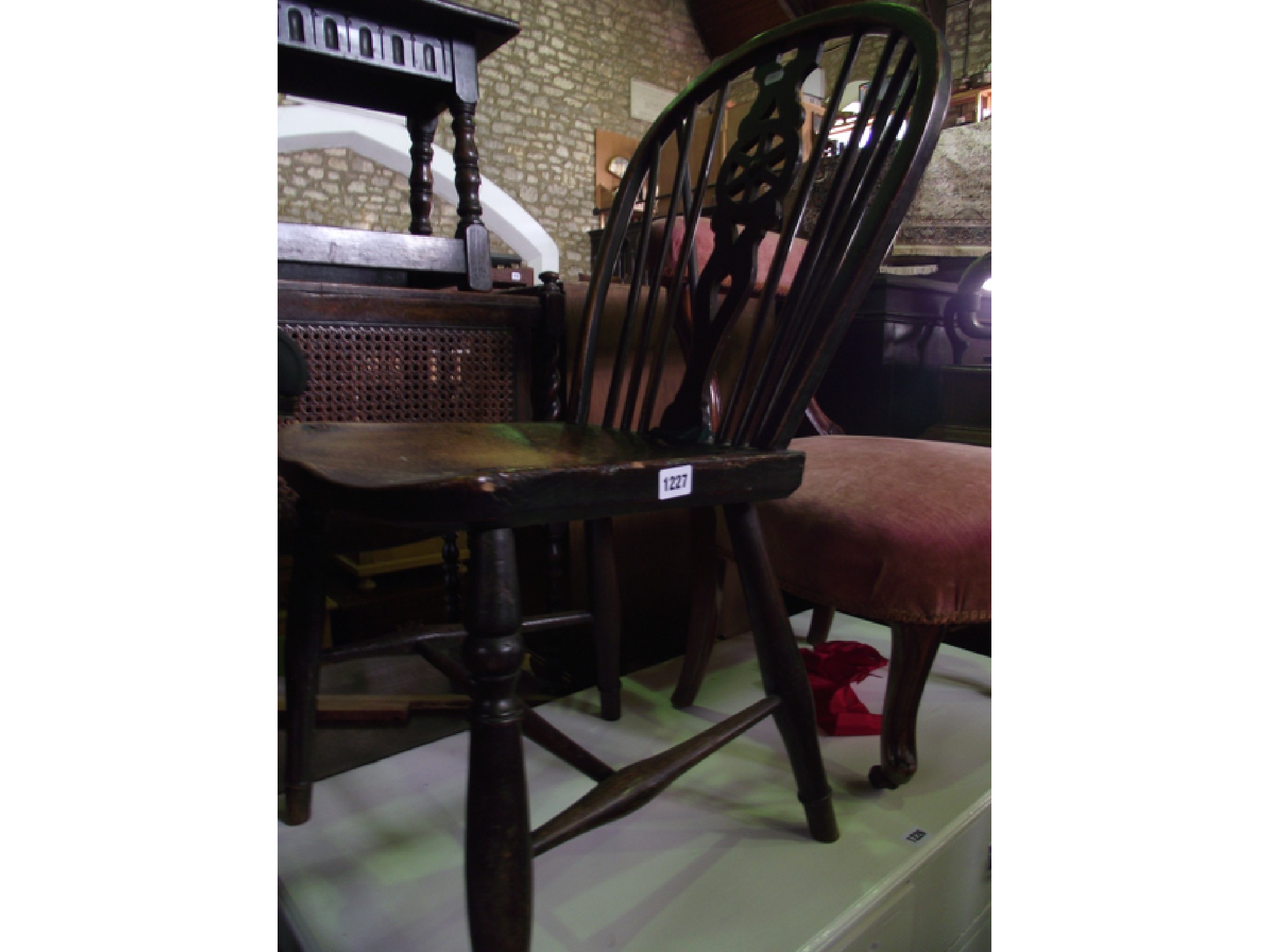 Appraisal: A Georgian Windsor wheel back kitchen chair with elm seat