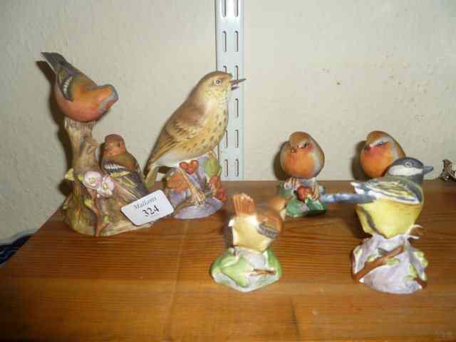 Appraisal: A ROYAL WORCESTER PORCELAIN MODEL of chaffinches a thrush a