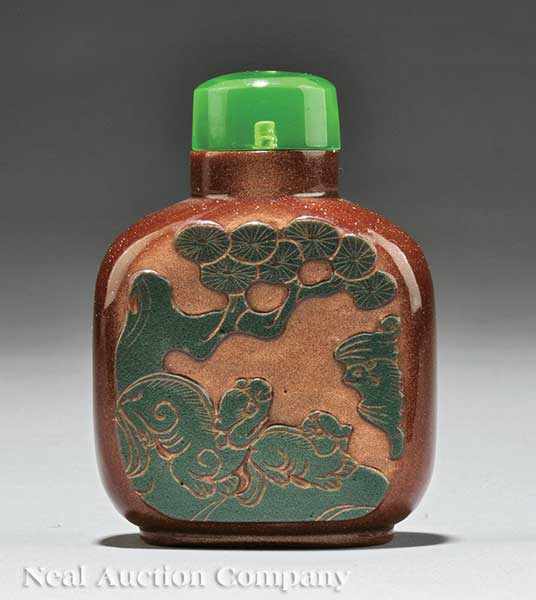 Appraisal: A Chinese Carved Glass Snuff Bottle - glass simulating hematite