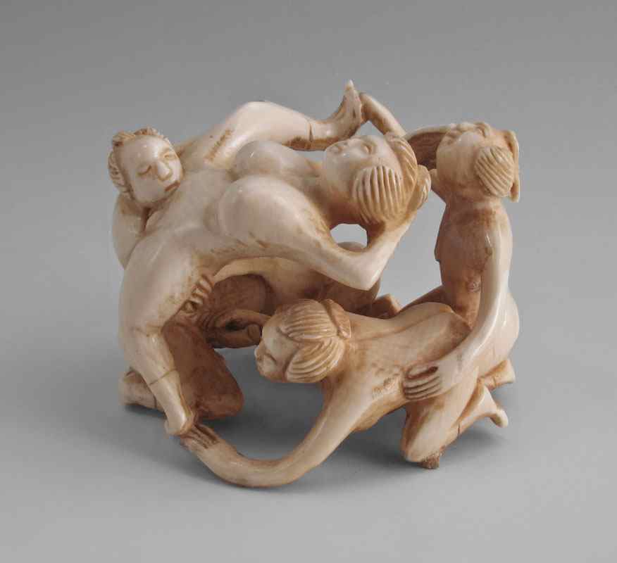 Appraisal: EROTIC CARVED IVORY FIGURAL GROUP Group of women and men