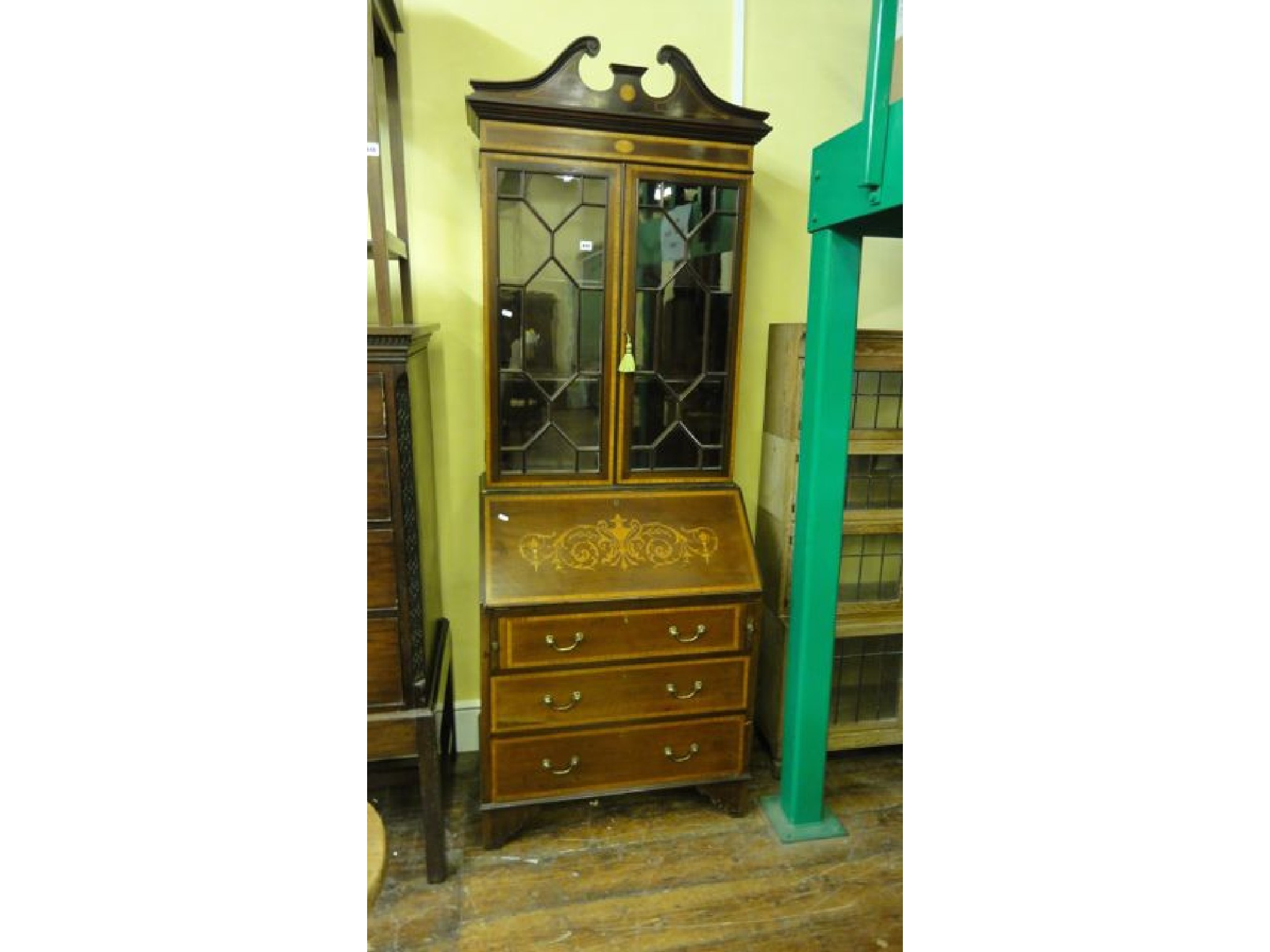 Appraisal: An Edwardian mahogany bureau bookcase the bureau fitted with three