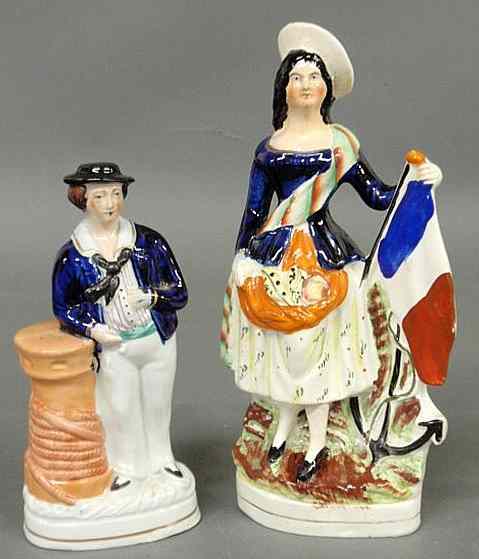 Appraisal: Two th c Staffordshire figures- sailor h and a woman