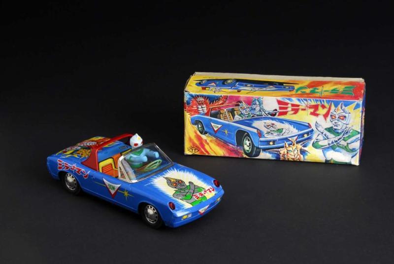 Appraisal: Mirror Man Driving Porsche Toy Description Japanese Working When in