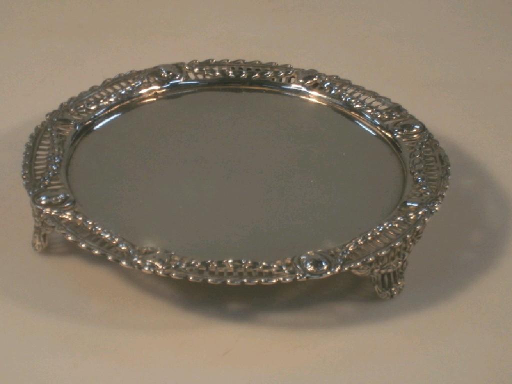 Appraisal: A Victorian silver card waiter with cast and pierced neo