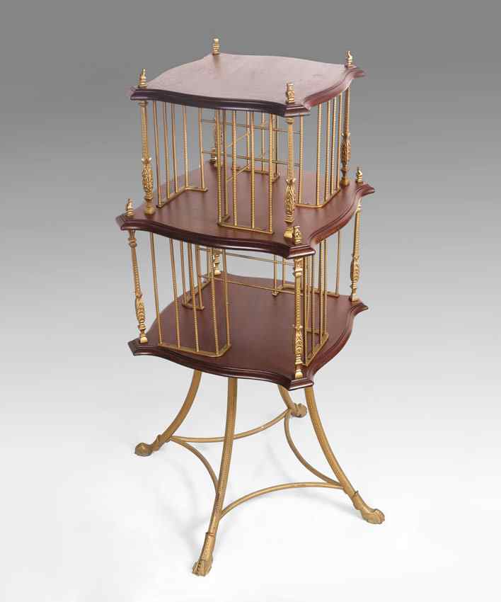 Appraisal: CAST BRASS AND WOOD REVOLVING BOOKCASE level with brass hardware