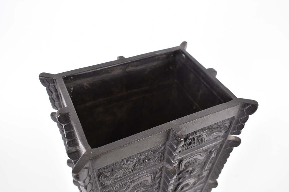 Appraisal: CHINESE ARCHAIC STYLE BRONZE VASEThe rectangular tapered vessel cast with