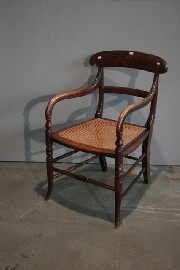 Appraisal: A Steamer cane chair in simulated rosewood