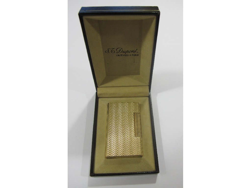 Appraisal: Dupont gold plated cigarette lighter with engine turned chevron decoration