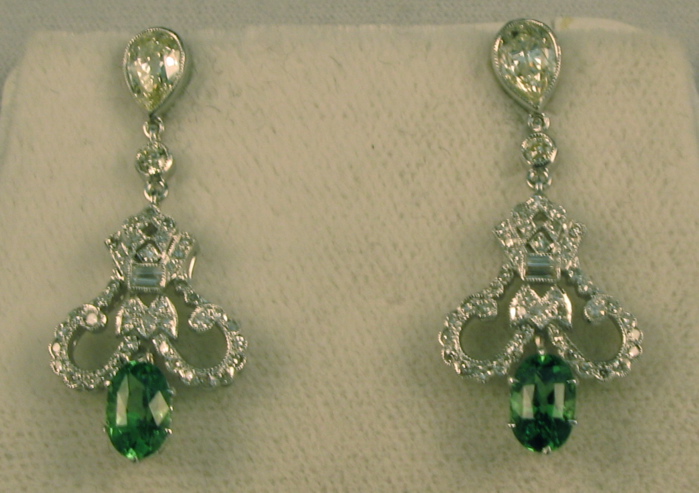 Appraisal: PAIR OF GREEN TSAVORITE GARNET DIAMOND AND EIGHTEEN KARAT WHITE