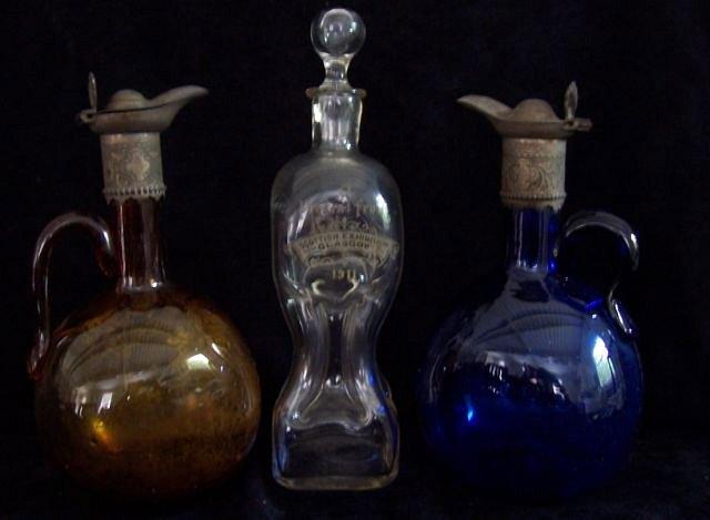 Appraisal: An hourglass shaped decanter marked 'A present from Scottish Exhibition