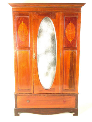 Appraisal: A late Victorian mahogany wardrobe the moulded cornice above central