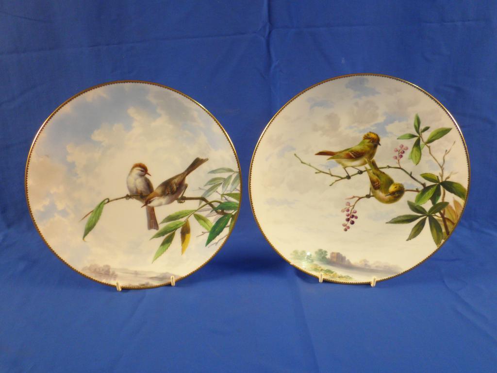 Appraisal: A pair of Minton's plates each decorated with birds in