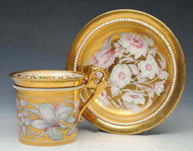 Appraisal: A DERBY GOLD GROUND CABINET CUP AND SAUCER circa applied