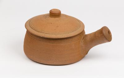 Appraisal: Bernard Leach - an unglazed stoneware casserole with tenmoku interior