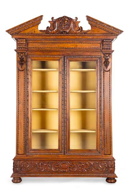 Appraisal: A Renaissance Revival carved display cabinet An imposing Continental Renaissance