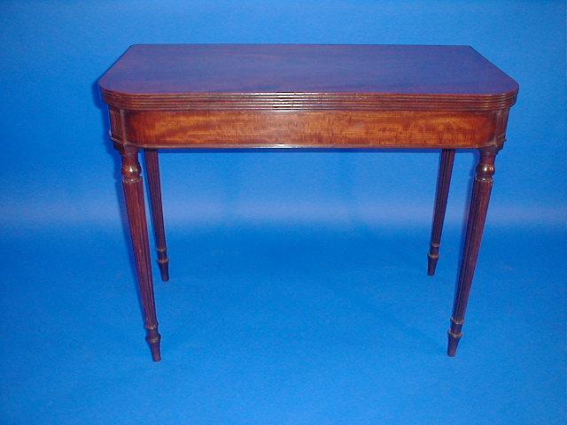 Appraisal: A th century flamed mahogany tea table with reeded folding