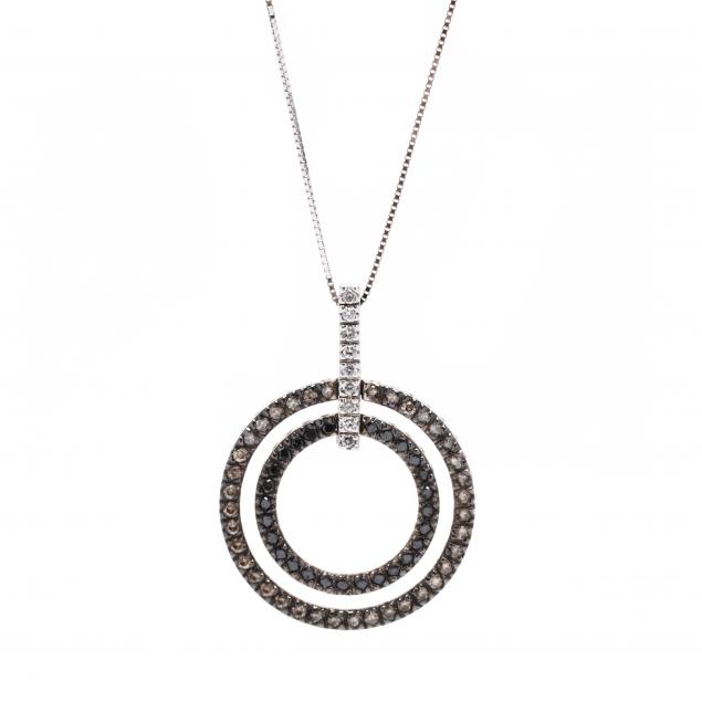 Appraisal: WHITE GOLD AND DIAMOND DOUBLE CIRCLE NECKLACE The pendant with