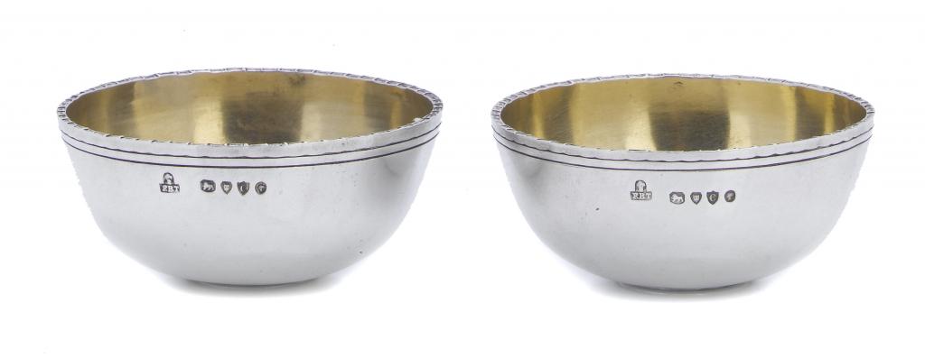 Appraisal: A PAIR OF VICTORIAN SALTS of plain almost hemispherical form