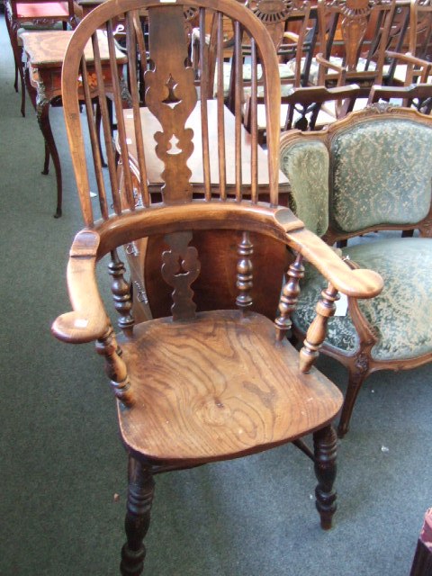 Appraisal: A th century ash and elm kitchen Windsor chair the