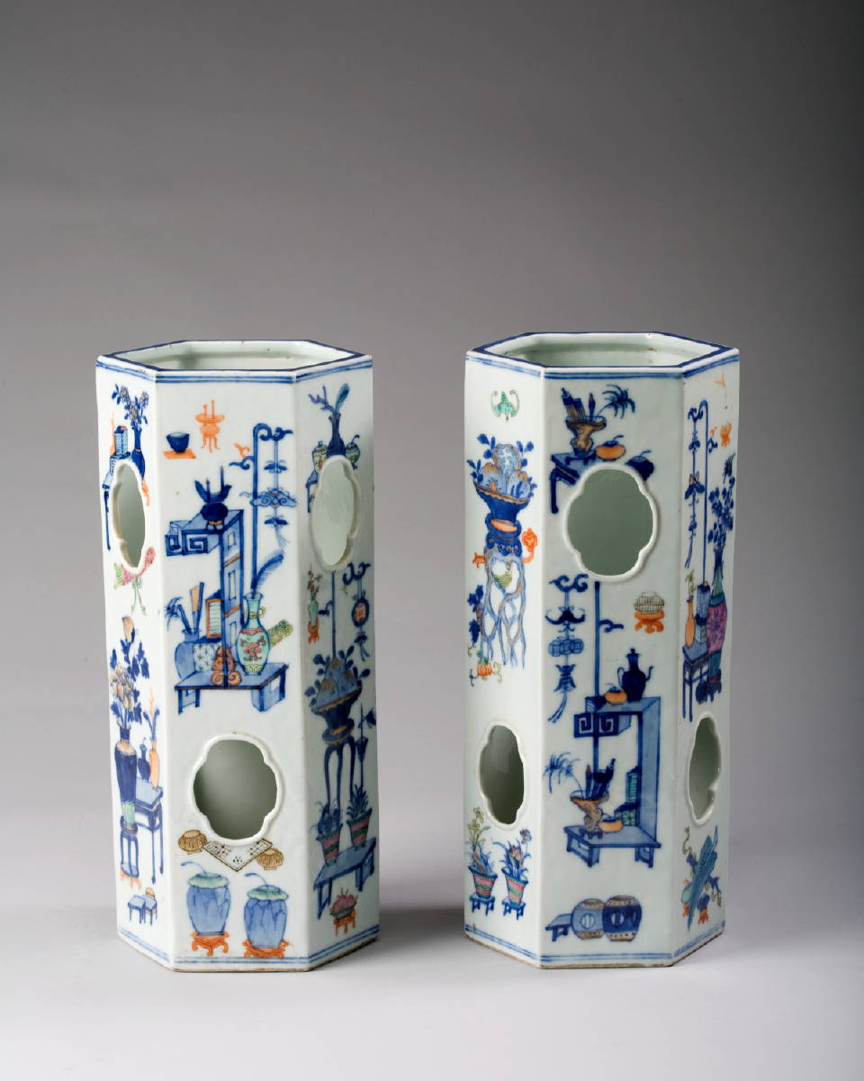 Appraisal: PAIR OF CHINESE PORCELAIN WIG STANDS Each painted with arrangements