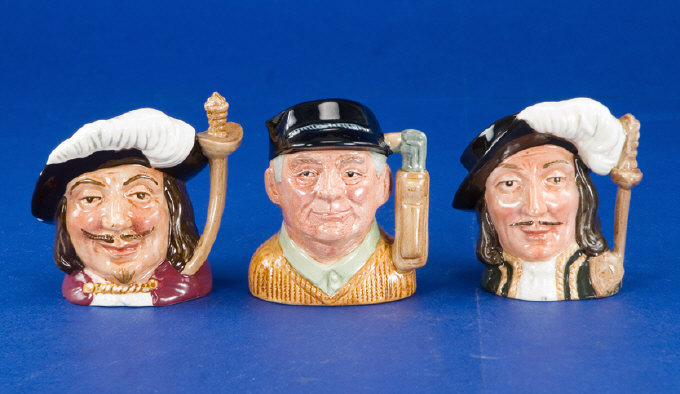 Appraisal: Three Royal Doulton Miniature Character Jugs comprising The Golfer D