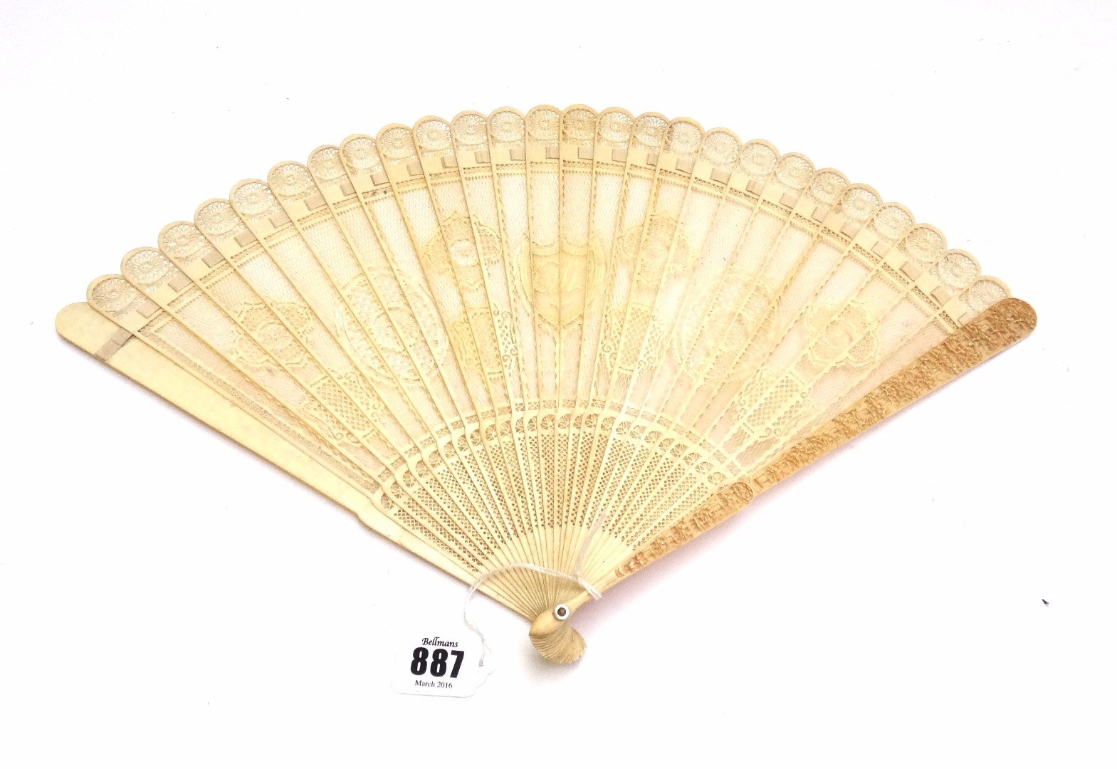 Appraisal: A Cantonese carved ivory fan early th century shield monogrammed