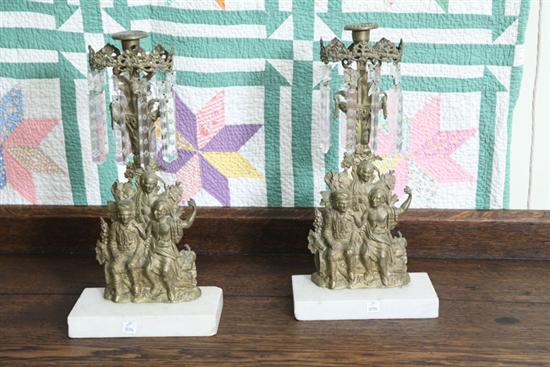 Appraisal: PAIR OF GIRANDOLES Brass single light candlesticks with figures of