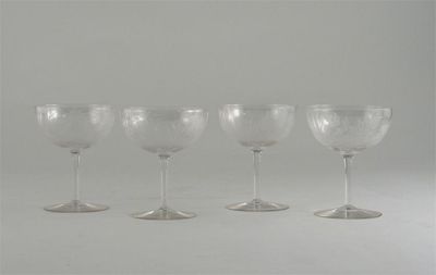 Appraisal: Four champagne glasses each bowl engraved with a spider in