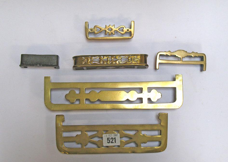 Appraisal: A COLLECTION OF FIVE MINIATURE BRASS FENDERS and a small