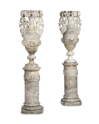 Appraisal: A monumental pair of carved agate urns circa The tops