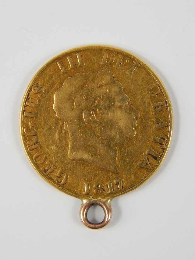 Appraisal: A George III gold half sovereign with loop attachment