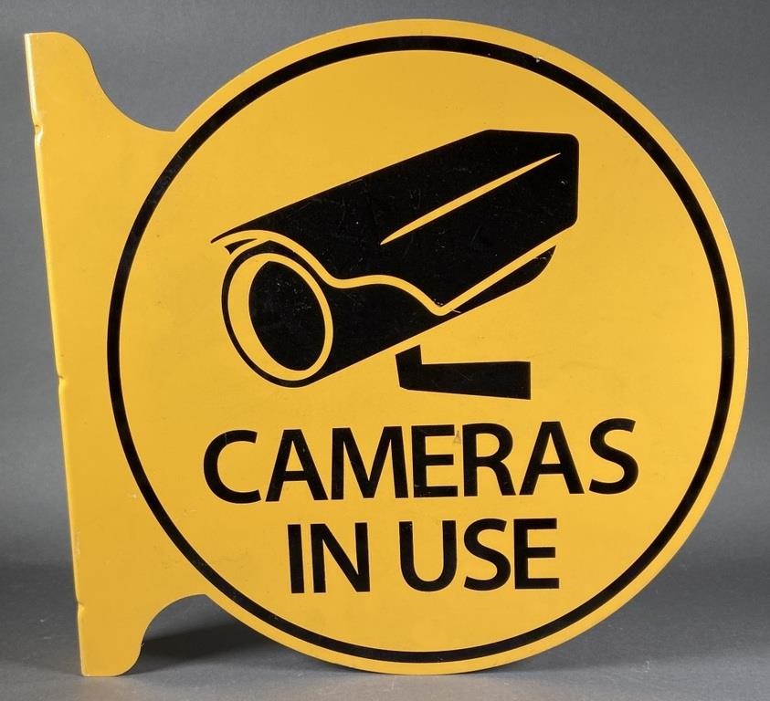 Appraisal: Yellow painted metal sign that reads CAMERAS IN USE with