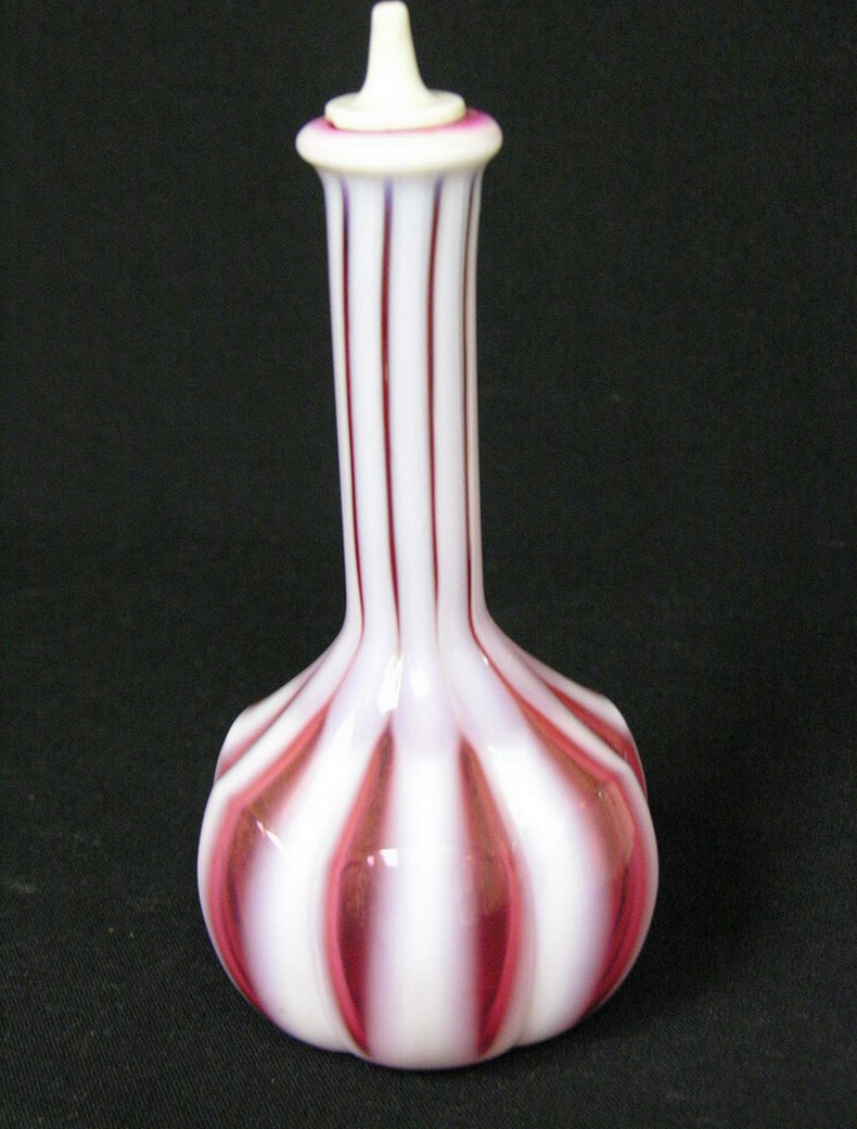 Appraisal: CRANBERRY OPALESCENT STRIPED BARBER BOTTLE Size with diameter Note Size