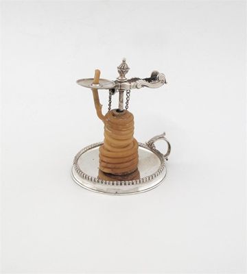 Appraisal: A George III wax jack on a dished gadrooned base