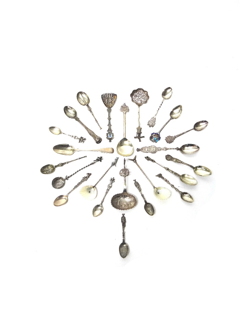 Appraisal: A collection of nine silver spoons including an enameled town