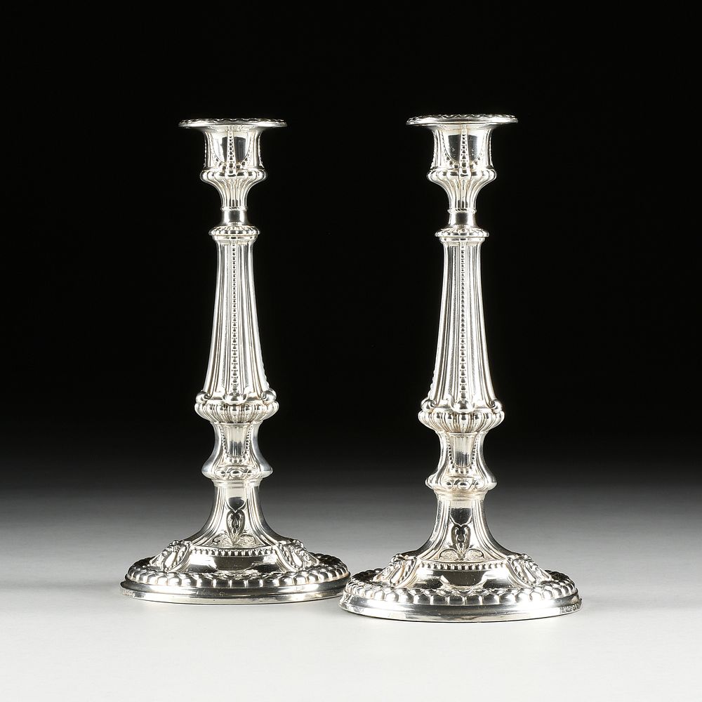 Appraisal: A PAIR OF ANTIQUE ENGLISH ELKINGTON ELECTROPLATED CANDLESTICKS MARKED BIRMINGHAM