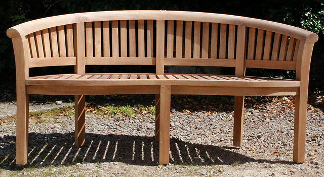 Appraisal: A CURVED AND SLATTED TEAK GARDEN BENCH cm wide