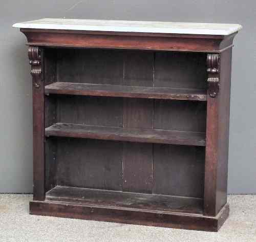 Appraisal: A Victorian mahogany open front dwarf bookcase with white marble