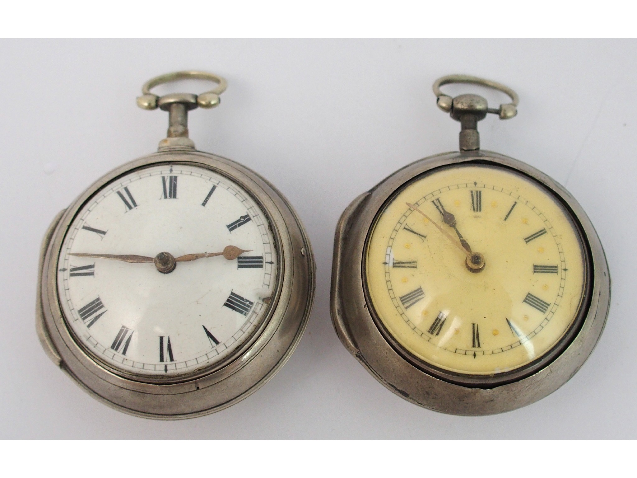 Appraisal: Two Georgian silver pair cased verge pocket watchesLondon matching cases