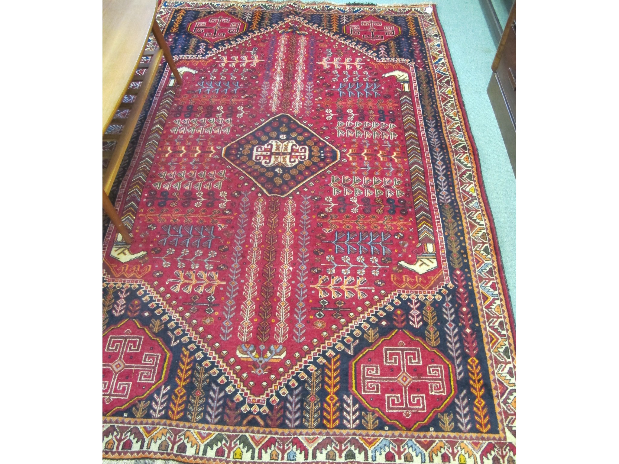 Appraisal: Shiraz rug on red and blue ground x m