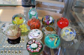 Appraisal: GLASS PAPER WEIGHTS AND FOUR GLASS FLOWERS INCL MURANO