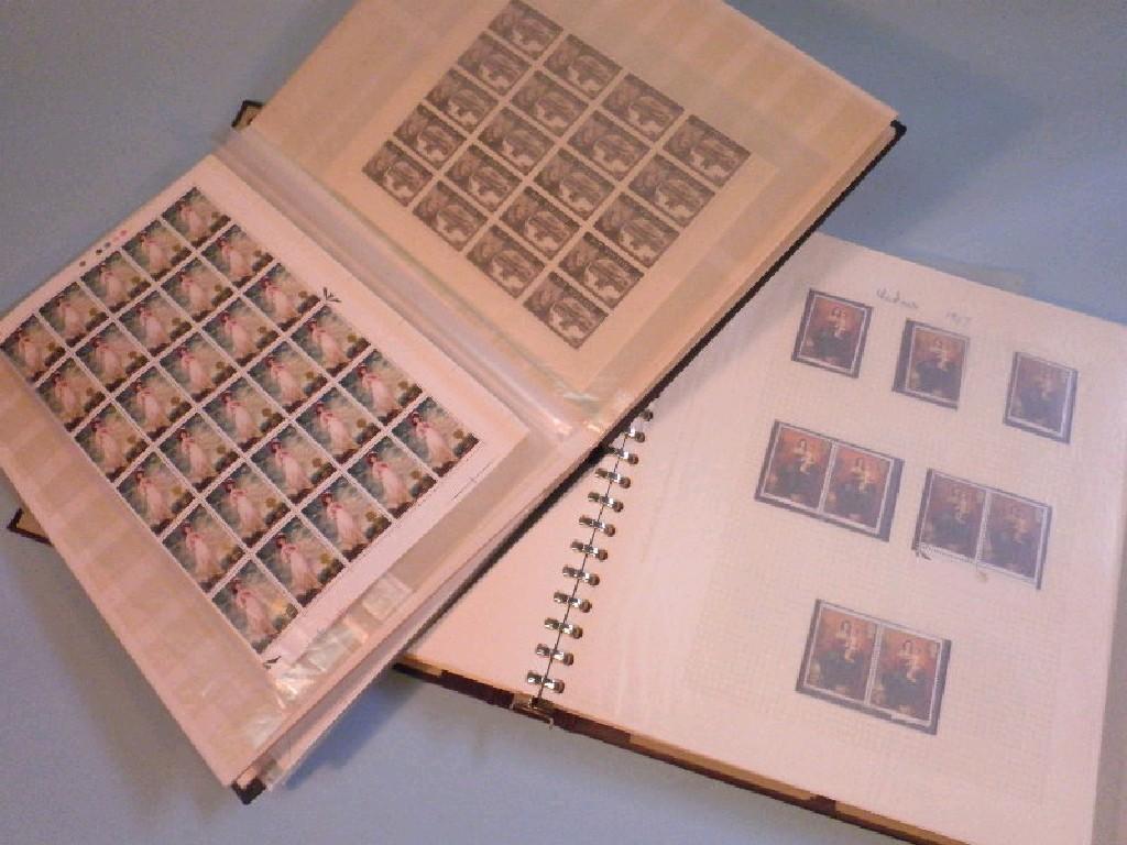 Appraisal: A stamp album and stock book containing sheets of uncirculated