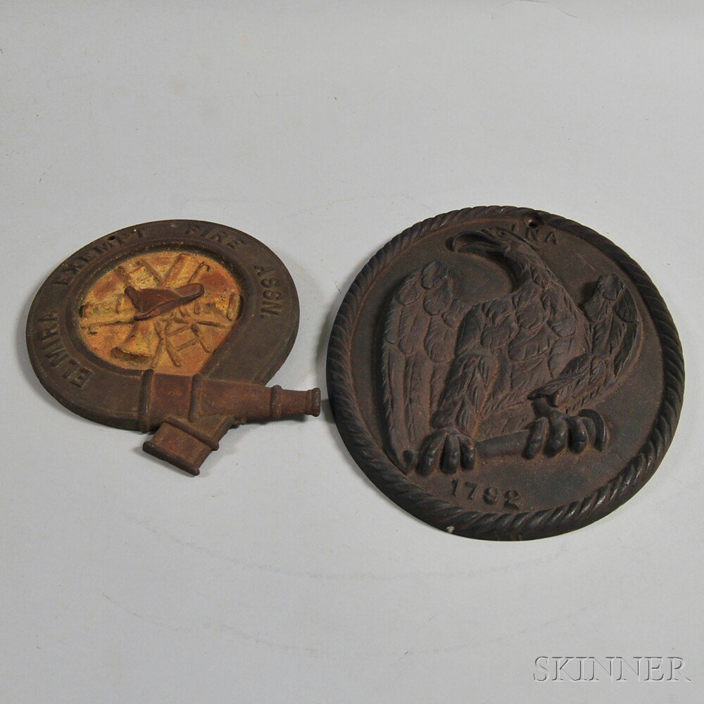 Appraisal: Two Cast Iron Firemarks an eagle within a braided oval