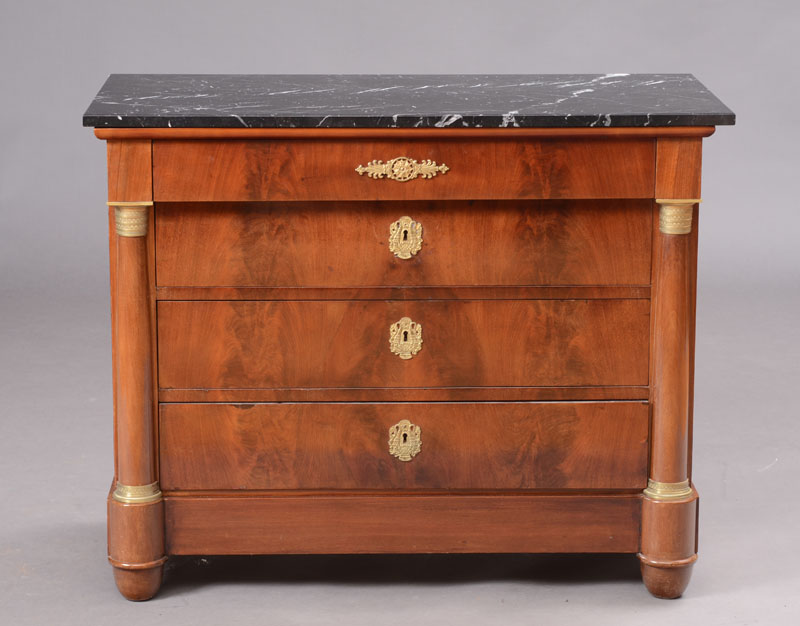 Appraisal: EMPIRE ORMOLU-MOUNTED MAHOGANY COMMODE With a black and white veined